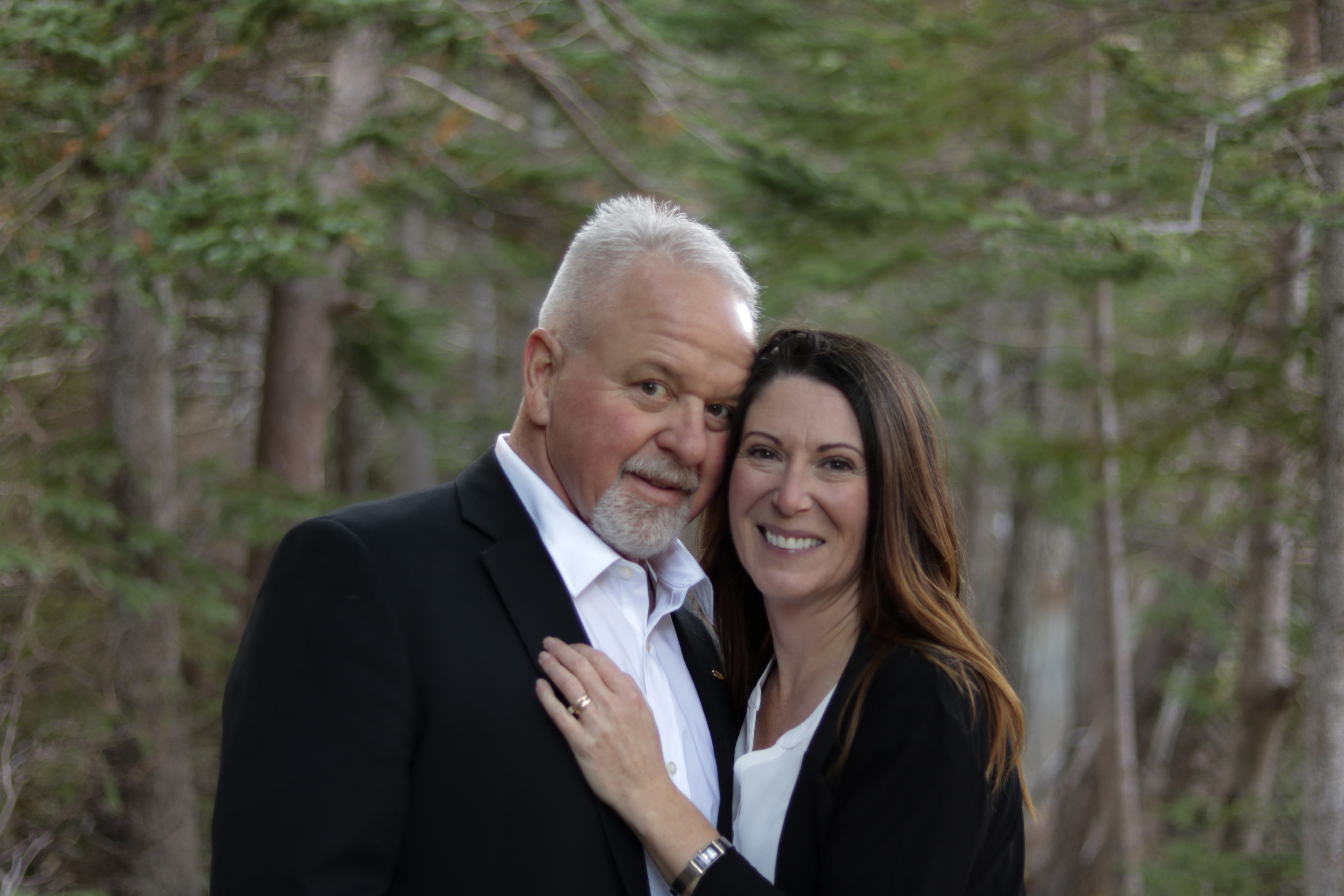 Boyd Merrill and his wife smiling together outdoors